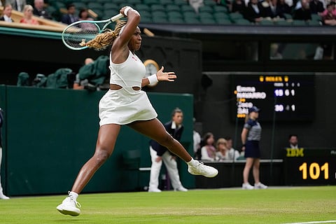 Coco Gauff plays a forehand return to Emma Navarro